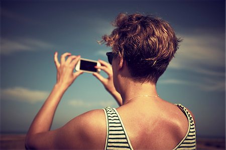 simsearch:6102-08996137,k - Woman taking picture Stock Photo - Premium Royalty-Free, Code: 6102-08942463