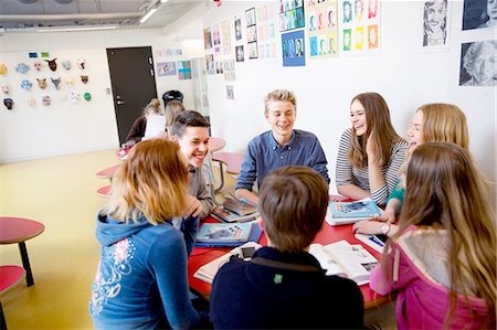 simsearch:6102-08951254,k - Teenagers talking in classroom Stock Photo - Premium Royalty-Free, Code: 6102-08951247