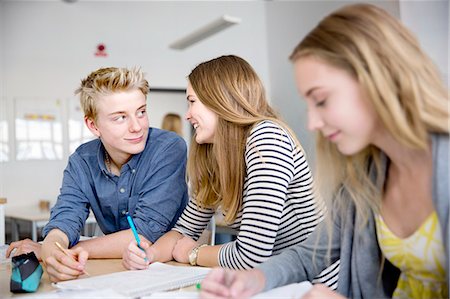 simsearch:6102-08951254,k - Teenagers talking in classroom Stock Photo - Premium Royalty-Free, Code: 6102-08951251