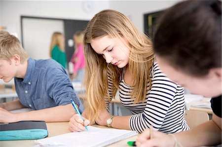 simsearch:6102-08951254,k - Teenage girl studying in classroom Stock Photo - Premium Royalty-Free, Code: 6102-08951259