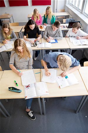 simsearch:6102-08951254,k - School children studying in classroom Stock Photo - Premium Royalty-Free, Code: 6102-08951203