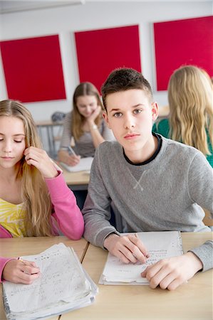 simsearch:6102-08951254,k - Teenagers sitting by desk Stock Photo - Premium Royalty-Free, Code: 6102-08951214