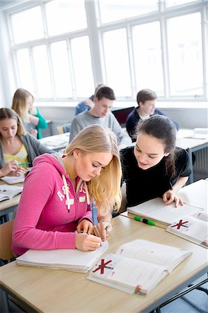 simsearch:6102-08951254,k - Teenage girls talking and learning in classroom Stock Photo - Premium Royalty-Free, Code: 6102-08951239