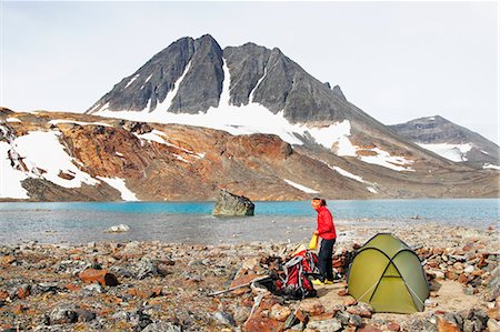 Woman camping at lake Stock Photo - Premium Royalty-Free, Code: 6102-08951643