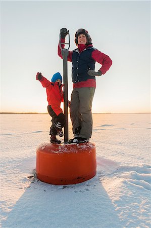 scandinavia winter woman - Woman standing on boy with son Stock Photo - Premium Royalty-Free, Code: 6102-08951963