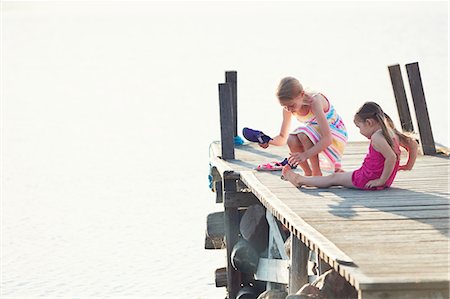 simsearch:6102-08952062,k - Girls on pier by lake Stock Photo - Premium Royalty-Free, Code: 6102-08952070