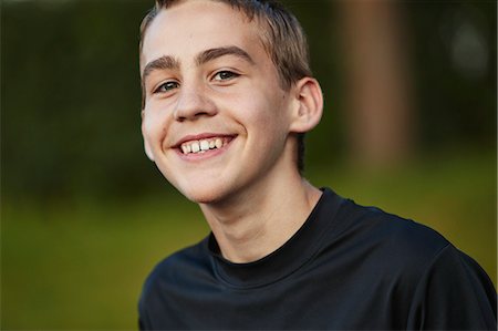 simsearch:6102-08942535,k - Portrait of smiling teenager looking at camera Stock Photo - Premium Royalty-Free, Code: 6102-08952024