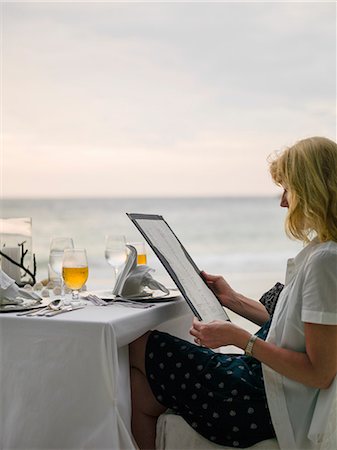 penang people - Woman reading menu in restaurant Stock Photo - Premium Royalty-Free, Code: 6102-08994965