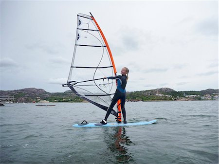 Woman windsurfing Stockbilder - Premium RF Lizenzfrei, Bildnummer: 6102-08995092