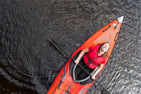 simsearch:6102-08062947,k - Woman relaxing on kayak Stock Photo - Premium Royalty-Free, Code: 6102-08995157