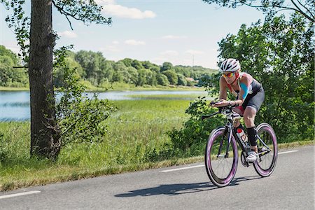 female triathlon - Woman cycling Stock Photo - Premium Royalty-Free, Code: 6102-08995315