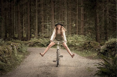 simsearch:6102-04929804,k - Happy teenage girl on bicycle Stock Photo - Premium Royalty-Free, Code: 6102-08995633