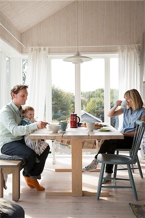 people at table - Family having meal Stock Photo - Premium Royalty-Free, Code: 6102-08996283