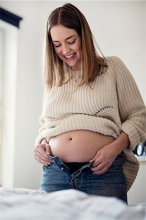 pregnant sweden - Pregnant woman getting dressed Stock Photo - Premium Royalty-Free, Code: 6102-08996661