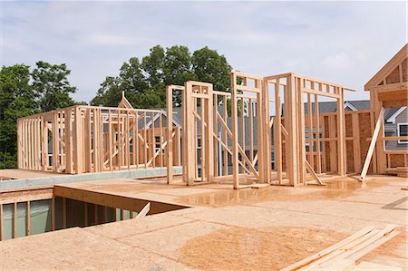 frame carpenters - Upper story framing for a house under construction Stock Photo - Premium Royalty-Free, Code: 6105-05395981