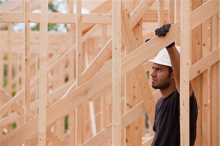 framing (activity) - Carpenter in house framing Stock Photo - Premium Royalty-Free, Code: 6105-05396041