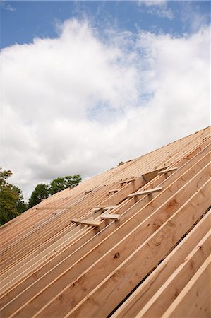 Roof rafters of a house under construction Foto de stock - Sin royalties Premium, Código: 6105-05396217