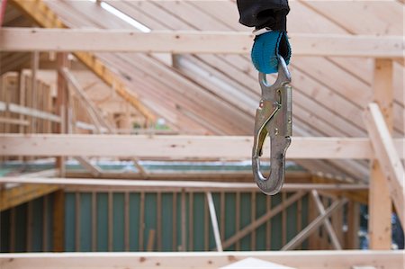 Safety harness hanging at a house under construction Foto de stock - Sin royalties Premium, Código: 6105-05396218