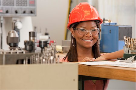 Engineering student studying in a machine lab Stock Photo - Premium Royalty-Free, Code: 6105-05396355