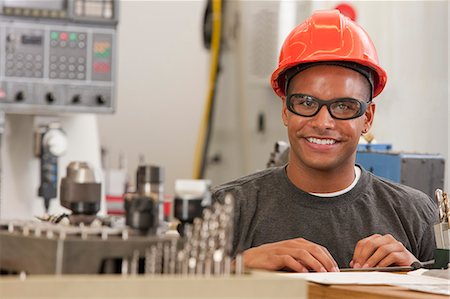 focused university students - Engineering student studying in a machine lab Stock Photo - Premium Royalty-Free, Code: 6105-05396356