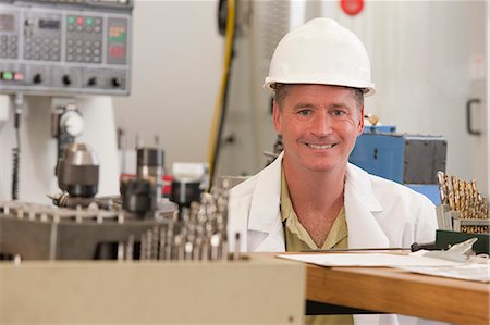 smart industry - Professor in smiling CNC lab Stock Photo - Premium Royalty-Free, Code: 6105-05396358