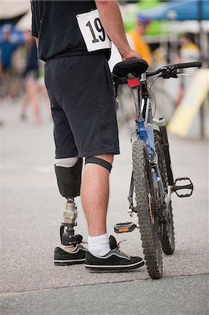 simsearch:6105-05396319,k - Man with prosthetic leg for a bike race Stock Photo - Premium Royalty-Free, Code: 6105-05396303