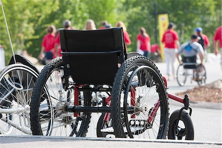 Wheelchair at the finish line of a bike race Stock Photo - Premium Royalty-Free, Code: 6105-05396309