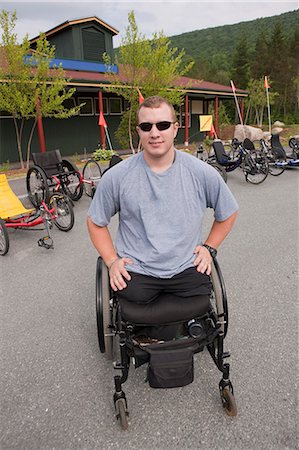 simsearch:6105-05396319,k - Man with leg amputee in a wheelchair preparing for a race Stock Photo - Premium Royalty-Free, Code: 6105-05396315