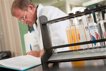 simsearch:6105-05396443,k - Scientist writing a sample report in the laboratory of water treatment plant Foto de stock - Sin royalties Premium, Código: 6105-05396464