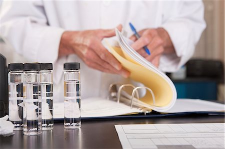 Scientist preparing a report in the laboratory of water treatment plant Stock Photo - Premium Royalty-Free, Code: 6105-05396477