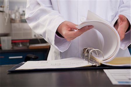 Scientist preparing a report in the laboratory of water treatment plant Stock Photo - Premium Royalty-Free, Code: 6105-05396479