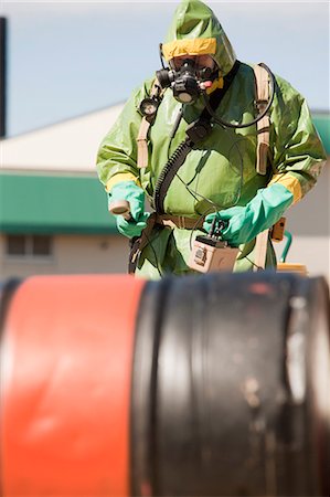 fire protection suit - HazMat firefighter taking radiation reading Stock Photo - Premium Royalty-Free, Code: 6105-05396494