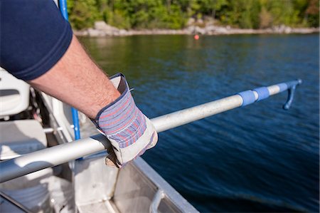 Scientist preparing boat hook to gaff the water samples Stock Photo - Premium Royalty-Free, Code: 6105-05396405