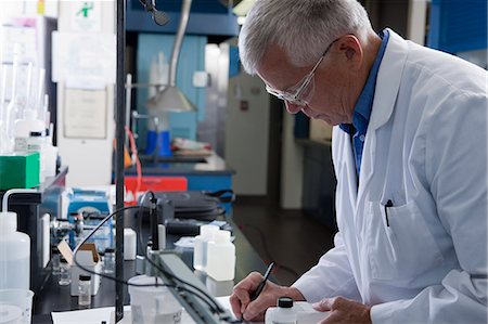 senior man document - Scientist writing a sample report in the laboratory of water treatment plant Stock Photo - Premium Royalty-Free, Code: 6105-05396425