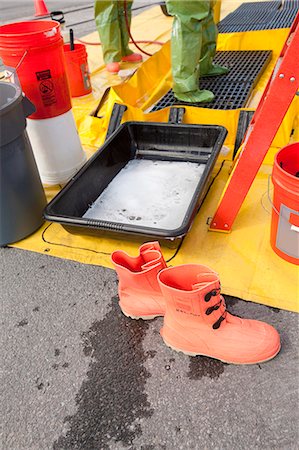 HazMat firefighter getting decontamination wash Stock Photo - Premium Royalty-Free, Code: 6105-05396526