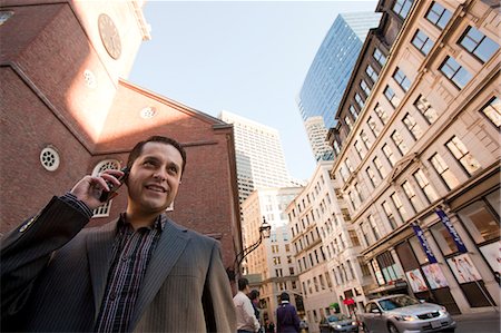 Businessman talking on a mobile phone Stock Photo - Premium Royalty-Free, Code: 6105-05396689