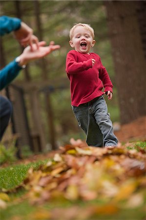 sign language kid - Woman signing the word 'Jump' in American Sign Language while communicating with her son in a park Stock Photo - Premium Royalty-Free, Code: 6105-05396779