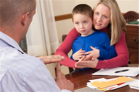 Woman signing the word 'Kindergarten/Nice' in American Sign Language while communicating with a man Stock Photo - Premium Royalty-Free, Code: 6105-05396786