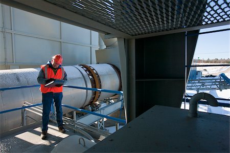 silo - Engineer recording data at materials plant Stock Photo - Premium Royalty-Free, Code: 6105-05396856