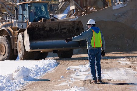 simsearch:6105-05396876,k - Engineer directing a front end loader at a construction site Stock Photo - Premium Royalty-Free, Code: 6105-05396897