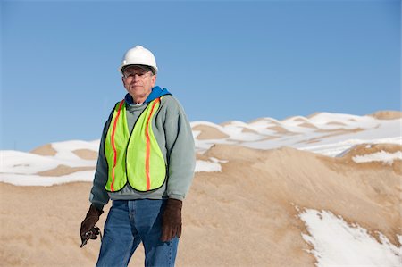 simsearch:6105-05396876,k - Engineer with walkie-talkie at a construction site in winter Stock Photo - Premium Royalty-Free, Code: 6105-05396900
