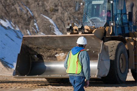 simsearch:6105-05396876,k - Engineer in front of an earth mover at a construction site Stock Photo - Premium Royalty-Free, Code: 6105-05396905