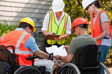 disabled security - Project engineers discussing data at new building site Stock Photo - Premium Royalty-Free, Code: 6105-05953697