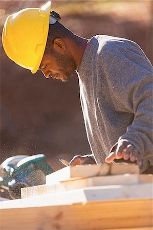 saw - Carpenter marking rafter cuts Stock Photo - Premium Royalty-Free, Code: 6105-06702840