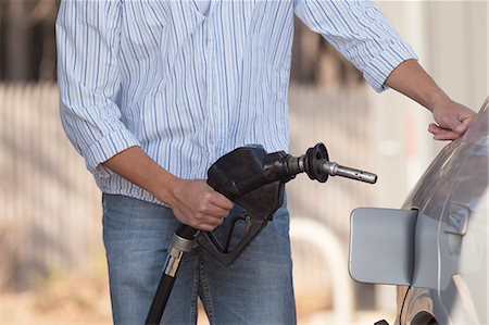 fossil fuel - Man refuelling his car at the gas station Stock Photo - Premium Royalty-Free, Code: 6105-06702870