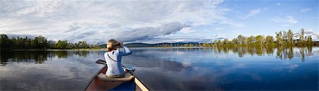 Woman in canoe at Lake Umbagog, New Hampshire, USA Stock Photo - Premium Royalty-Free, Code: 6105-06702813
