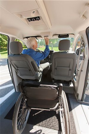 Man with muscular dystrophy and diabetes driving an accessible van Stock Photo - Premium Royalty-Free, Code: 6105-06702975