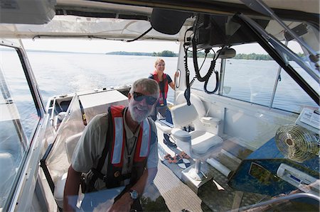 ship boat front view - Two engineers on service boat preparing to take water samples from public water supply Stock Photo - Premium Royalty-Free, Code: 6105-06703094