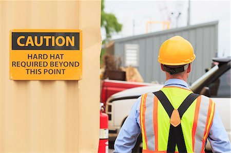 Electrical engineer wearing hard hat in a power plant facility Stock Photo - Premium Royalty-Free, Code: 6105-07521449