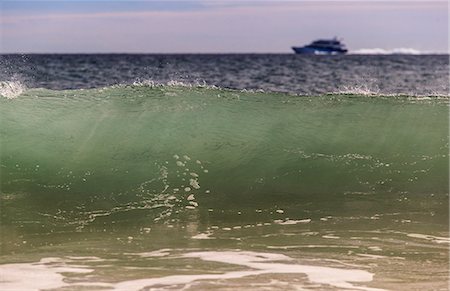 simsearch:6105-07744394,k - Breaking wave on Crescent Beach with high speed ferry in background, Block Island, Rhode Island, USA Stock Photo - Premium Royalty-Free, Code: 6105-07744387